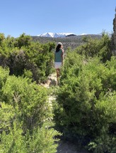 a woman hiking on a trail 