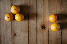 oranges on a wood table 