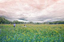 children running in a meadow