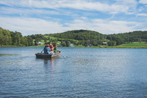 rowing in a paddle boat on a lake 