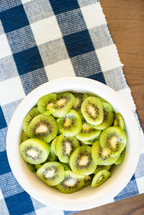 bowl of sliced kiwi fruits 