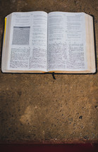 open Bible on a concrete 