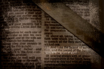 sword lying on the pages of a Bible - and take the helmet of salvation and the sword of the spirit 