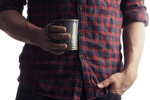 Holding a coffee cup.