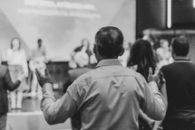 Black and white - Man with raised hands in worship