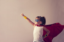 Girl in a superhero costume.