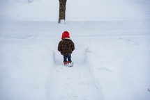 toddler playing in snow 