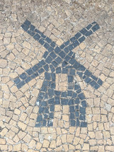 Paving stones with shapes of a Dutch Windmill. Holambra, SP, Brazil. June 30, 2024.