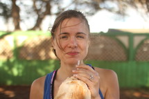 a woman drinking coconut milk 