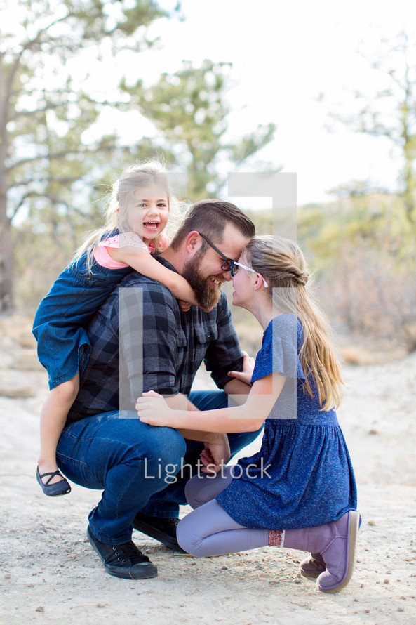 father connecting with two daughters 