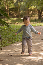 toddler boy learning to walk 