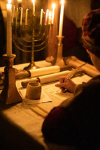 copying a scroll in candlelight 