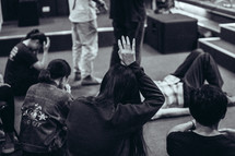 kneeling in prayer during a worship service 