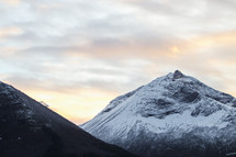 snow capped mountain peak at sunrise 