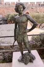 Bronze Statue of David standing over Goliath's Severed Head