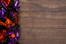 Halloween candy on wood background 