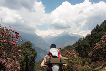 man backpacking through mountain trails 