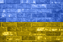 A Ukrainian Flag over a Brick Wall