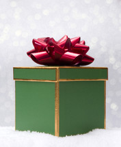 red bow on a green gift box 