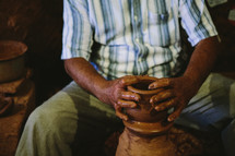 A man making pottery 