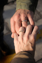 married couple with interlaced fingers 