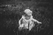 infant girl in grass