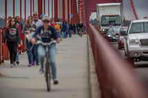 pedestrians and bicyclists on a bridge 