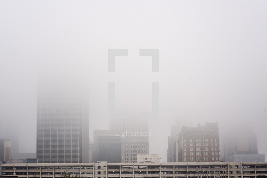 city buildings in fog 