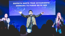 worship leaders singing on stage 