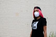 a  portrait of a young African American woman in a face mask with copy space 