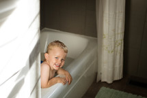 toddler boy in the bathtub 