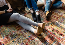 women's legs on a rug