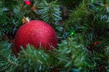 red ornament on a Christmas tree 
