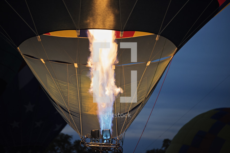 rising hot air balloons at night 