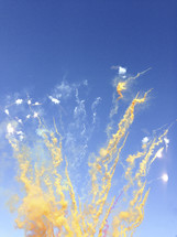 smoke and sparks in a blue sky 
