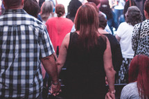 congregation holding hands 