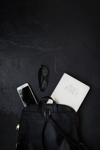 Bible, phone, and reading glasses in a backpack 