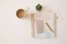 coffee mug, notebook, pencil, stationary 