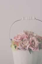 roses in a white pail 