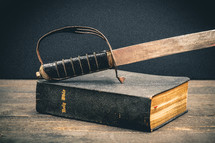 a sword on Bible 