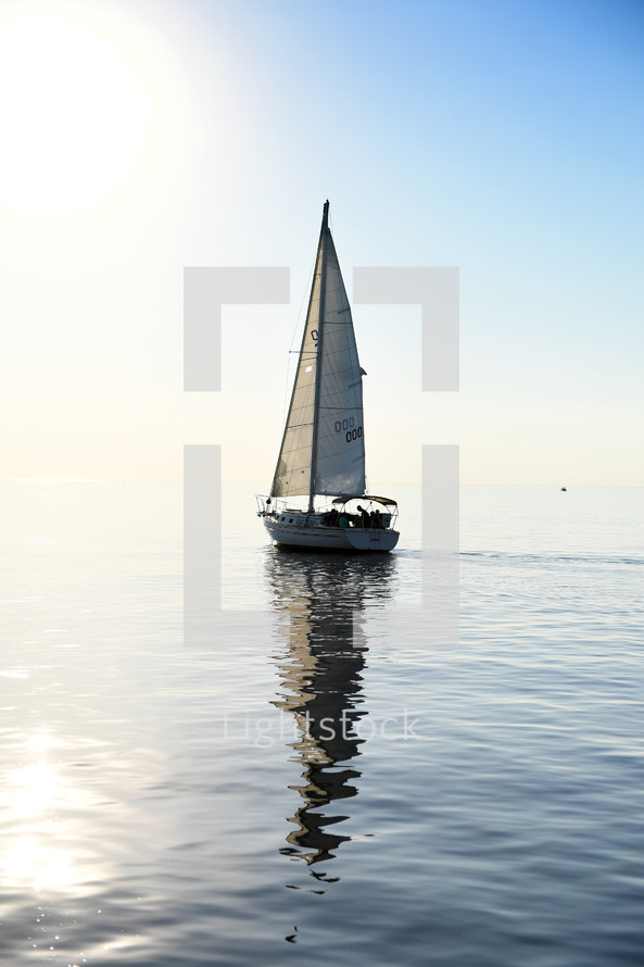 sailboat sailing on calm water 