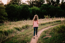 Girl walking along a path