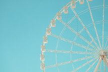 Ferris Wheel against blue sky