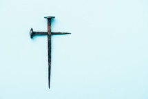 Cross made with rusty nails. Copy space. Good Friday, Easter day. Christian backdrop. Biblical faith, gospel, salvation concept. Crucifixion of Jesus Christ