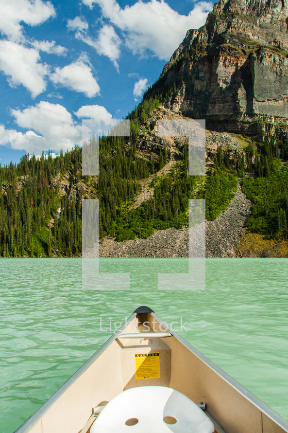 stern of a canoe on a mountain lake 