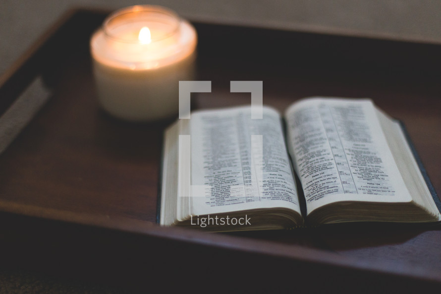 open Bible and candle 