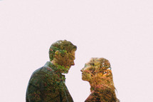 silhouette of a couple in love out of fall leaves 