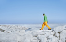 man hiking through snow 