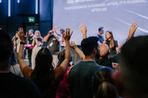 Hands raised in worship at church