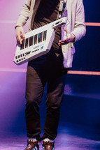 Man playing on a keytar